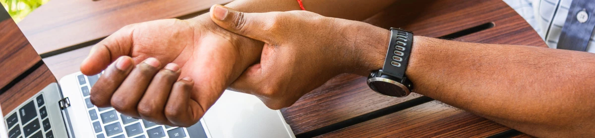 A person taking their own pulse