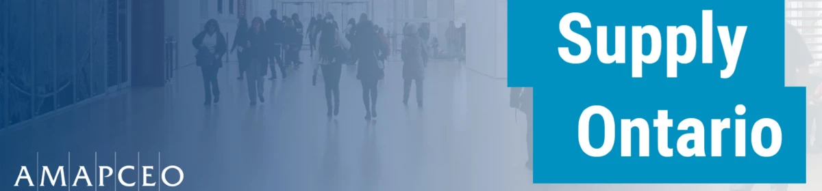 a group of people walking through an office hallway "Supply Ontario"