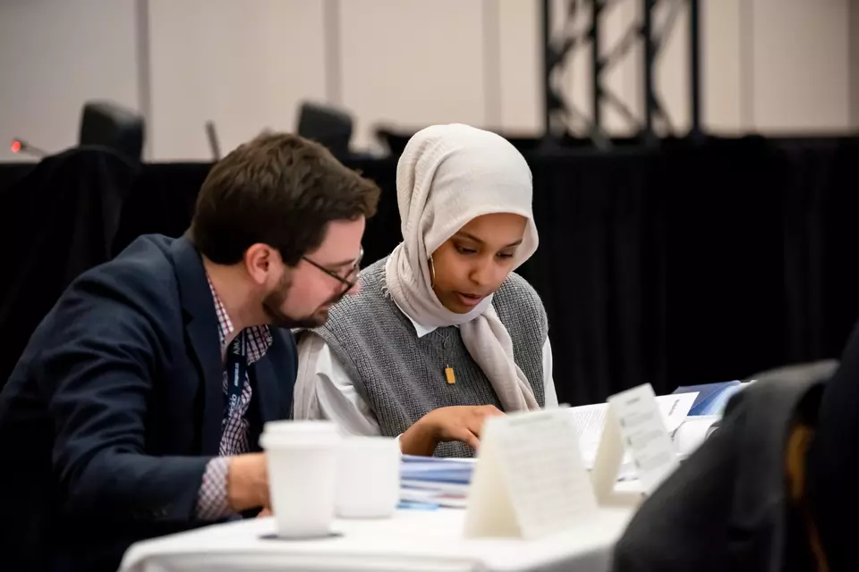 Two members looking at the same document