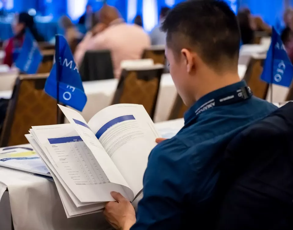 A member reading an AMAPCEO pamphlet