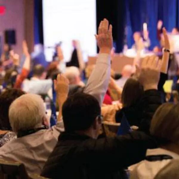 AMAPCEO members raising their hands at ADC Conference