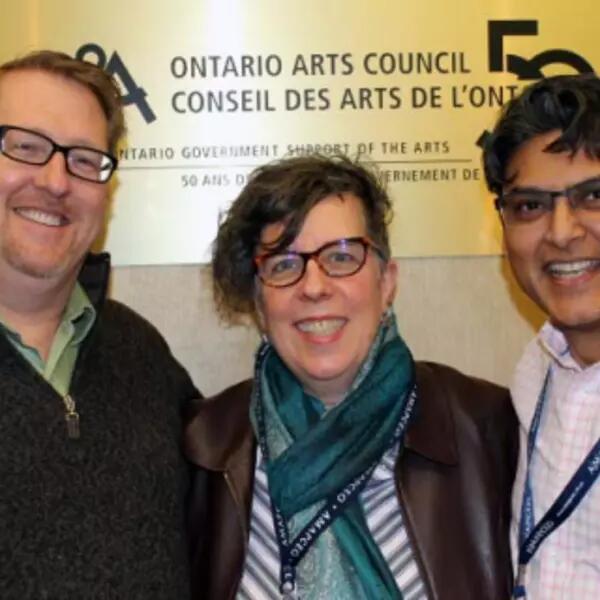 President Dave Bulmer stands with the Ontario Arts Council bargaining team in front of their offices/