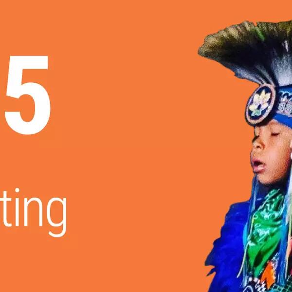 215 and counting - with a young Indigenous person in traditional clothing