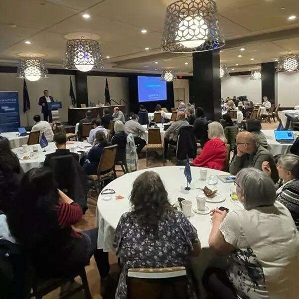 Members gathered in a conference room for the spring 2023 ALF