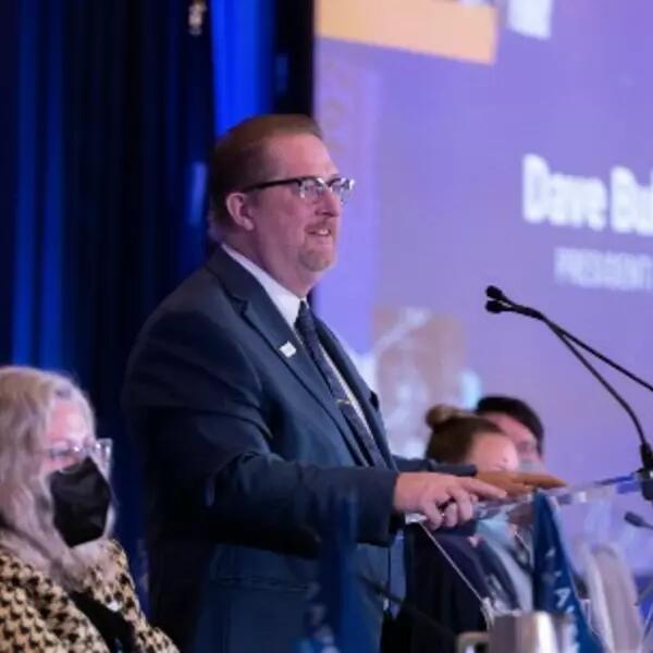 President Dave Bulmer speaking at a podium