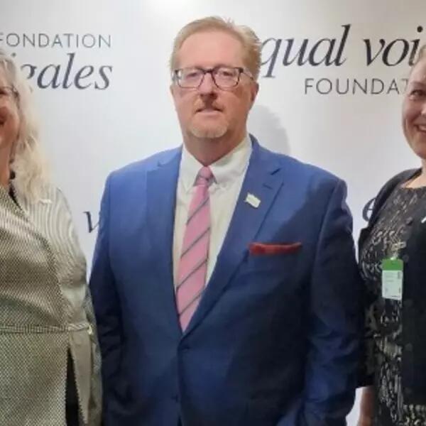 Cynthia Watt, Dave Bulmer, and Angela Stewart attending an International Women's Day event