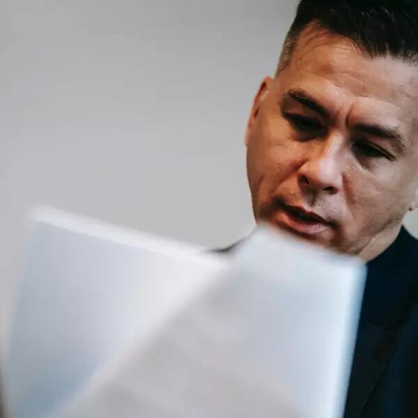 a person looking over a series of documents 
